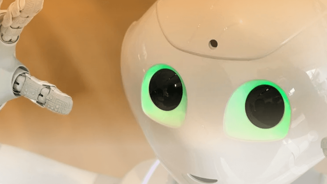 A robot with big green eyes and white skin.